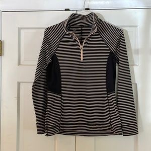 Nice pullover with zipper. Tailored and neat. Sides have ribbed fabric.